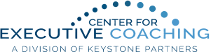 Logo for Center for Executive Coaching, a division of Keystone Partners, featuring blue text with a semicircle of blue dots above the words.