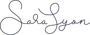 The image shows the handwritten name "Sara Lyon" in cursive blue lettering on a white background, ideal for an ecommerce business coach Perth looking to showcase their personal brand.
